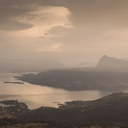 A hazy coastline at dusk